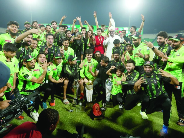 lahore qalanders players celebrate with the hbl pslx trophy at the gaddafi stadium in lahore photo m shafiq awan express