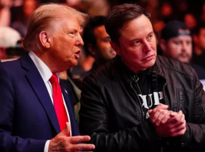 elon musk s omega necklace at ufc 309 with trump sparks speculation is omega symbolizing the end