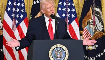 us president donald trump gestures as he speaks during a women s month history event in the east room of the white house in washington dc on march 12 2026 photo afp