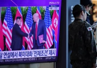a south korean soldier stands next to a tv broadcasting a news report on a possible summit between north korean leader kim jong un and us president donald trump at a railway station in seoul south korea october 22 2025 photo reuters