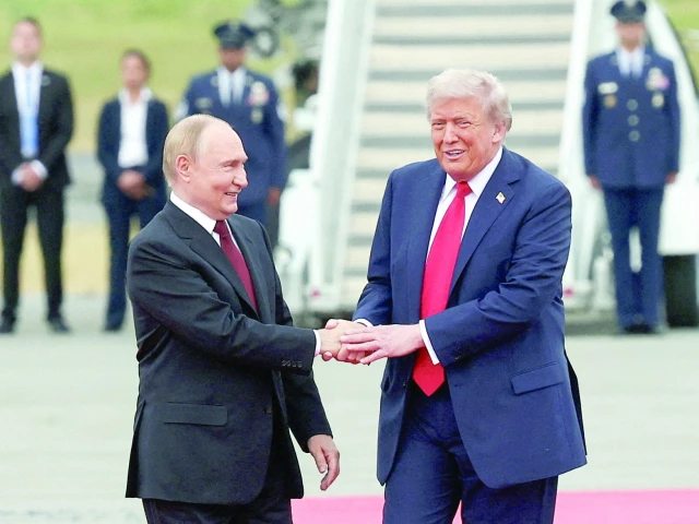 us president donald trump shakes hand with russian president vladimir putin at joint base elmendorf richardson in anchorage alaska photo reuters