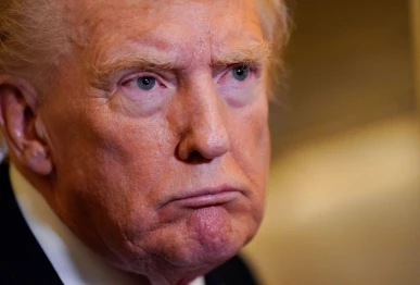 us president donald trump looks on while speaking to members of the media as he flies from florida to joint base andrews en route to washington aboard air force one us october 19 2025 photo reuters