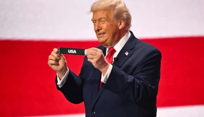 us president donald trump shows the card reading usa during the draw for the 2026 fifa football world cup taking place in the us canada and mexico at the kennedy center in washington dc on december 5 2025 photo afp