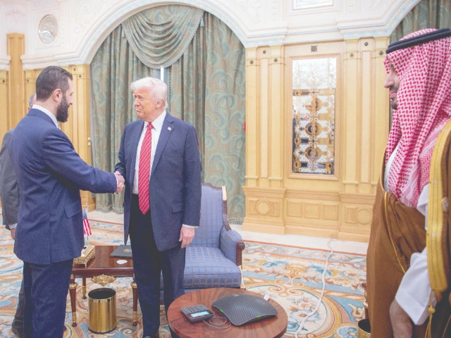 us president donald trump shakes hands with syria s interim president ahmed al sharaa in riyadh photo afp us president donald trump shakes hands with syria s interim president ahmed al sharaa in riyadh photo afp