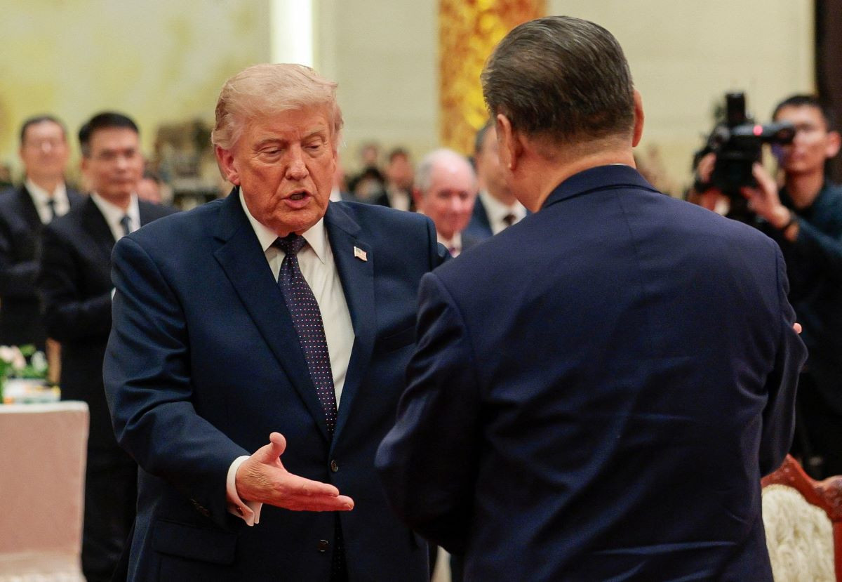US President Donald Trump reaches to shake hands with Chinese President Xi Jinping at a state banquet at the Great Hall of the People in Beijing, China, May 14, 2026. REUTERS