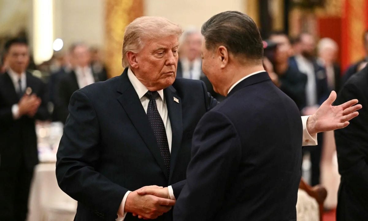 China’s President Xi Jinping (R) and US President Donald Trump shake hands as they attend a state banquet at the Great Hall of the People in Beijing on May 14, 2026. PHOTO:AFP