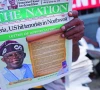 people read newspapers reporting on us airstrikes against islamic state militants in lagos nigeria photo reuters