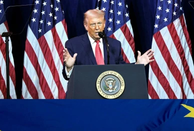 combo this combination of pictures created on january 19 2026 shows us president donald trump speaks during the house republican party gop member retreat at the kennedy center in washington dc on january 6 2026 top and a giant eu flag waved by demonstrators during a protest in tbilisi on april 28 2024 european leaders on january 18 2026 slammed us president donald trump s threat of tariffs over their opposition to his designs on greenland photo afp