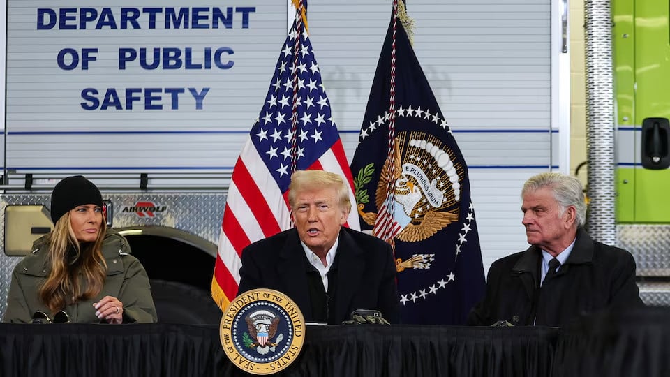 us president donald trump speaks flanked by first lady melania trump and franklin graham president of samaritan s purse during a disaster briefing at a hanger as he visits to assess recovery efforts and tour areas devastated by hurricane helene at asheville regional airport in asheville photo reuters