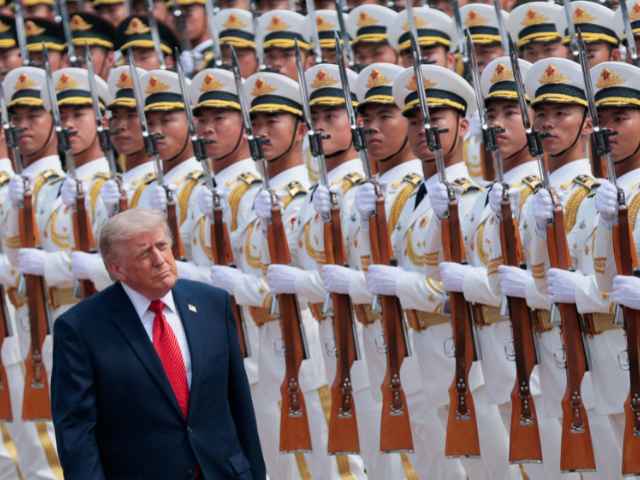 US President Donald Trump inspects an honour guard during a welcome ceremony with Chinese President Xi Jinping (not pictured) at the Great Hall of the People in Beijing, China, May 14, 2026. PHOTO: REUTERS