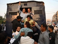 policemen detain pakistan tehreek e insaf supporters during a protest against the 27th constitutional amendment in karachi on november 21 2025 photo afp