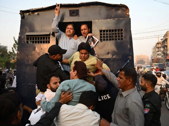 policemen detain pakistan tehreek e insaf supporters during a protest against the 27th constitutional amendment in karachi on november 21 2025 photo afp policemen detain pakistan tehreek e insaf supporters during a protest against the 27th constitutional amendment in karachi on november 21 2025 photo afp