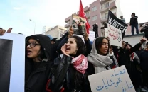 tunisians protest against political economic conditions