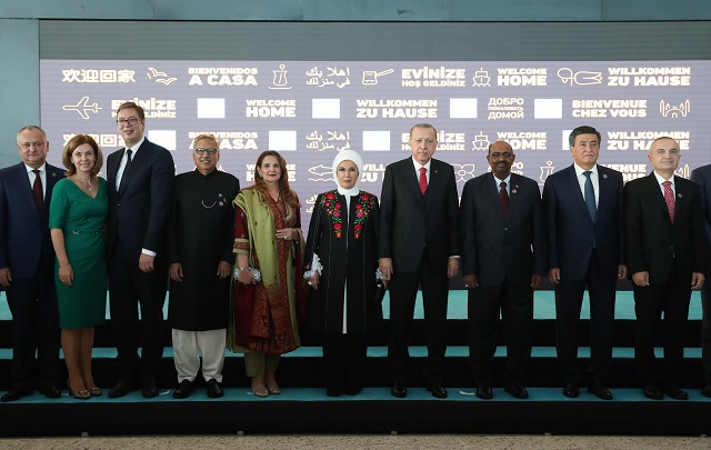 A handout picture taken and released on October 29, 2018 by the Turkish Presidential Press Service shows Turkish President Recep Tayyip Erdogan (L) and his wife Emine Erdogan (R)doing a symbolic check-in and taking their tickets on the opening day of the Istanbul New Airport in Istanbul. - Erdogan opened Istanbul's new international airport, which his government says will eventually become the world's largest, with great fanfare on October 29. PHOTO: AFP