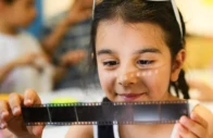 eight year old zeynep observes a roll of film during a workshop organized as part of the fotohane darkroom project in mardin southeastern turkey on june 13 2026 yasin akgul afp