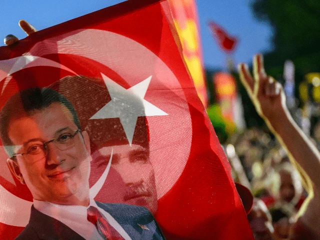 a supporter holds a flag of istanbul s detained mayor ekrem imamoglu and the first president of the republic of turkiye mustafa kemal ataturk as they listen to the leader of turkey s main opposition republican people s party chp ozgur ozel not pictured during a rally protesting the 100th day of the detention of istanbul s mayor in sarachane square istanbul on july 1 2025 photo afp a supporter holds a flag of istanbul s detained mayor ekrem imamoglu and the first president of the republic of turkiye mustafa kemal ataturk as they listen to the leader of turkey s main opposition republican people s party chp ozgur ozel not pictured during a rally protesting the 100th day of the detention of istanbul s mayor in sarachane square istanbul on july 1 2025 photo afp