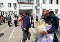 people wait in front of the school building after a deadly shooting in the southeastern province of kahramanmaras turkey april 15 2026 picture taken with a mobile phone photo ihlas news agency via reuters people wait in front of the school building after a deadly shooting in the southeastern province of kahramanmaras turkey april 15 2026 picture taken with a mobile phone photo ihlas news agency via reuters