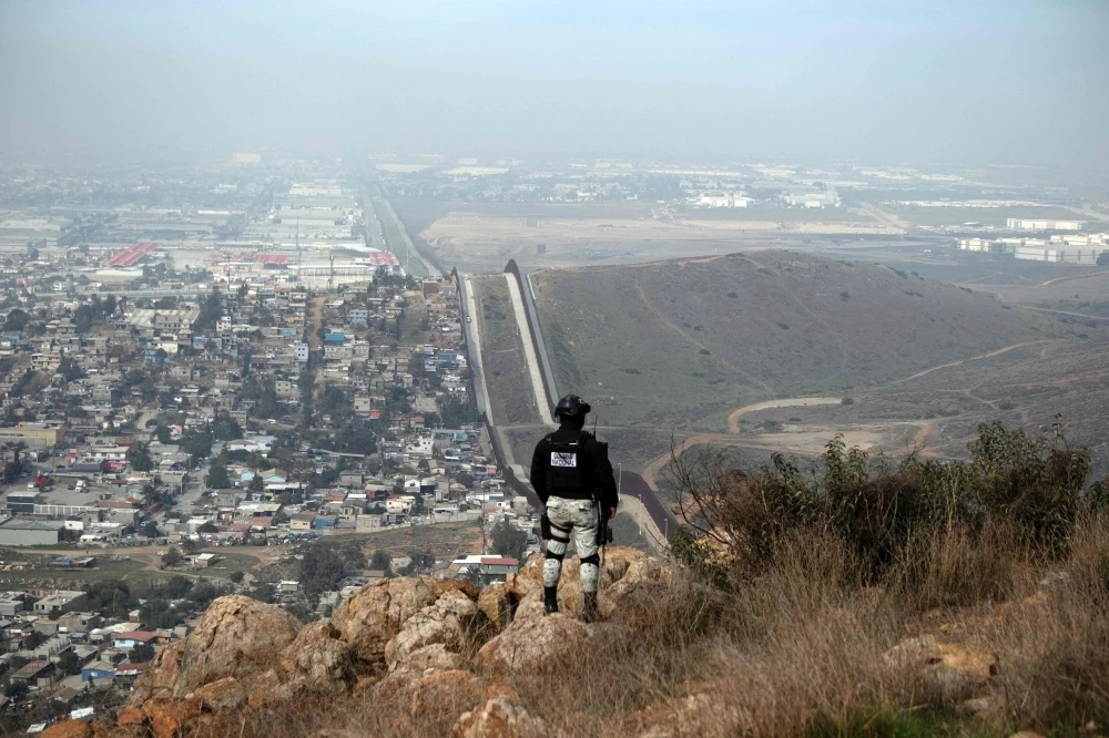 a mexican national guard officer patrols at a high point of el nido de las aguilas in eastern tijuana baja california state mexico on march 5 2025 on the mexican side of the mexico us border photo afp a mexican national guard officer patrols at a high point of el nido de las aguilas in eastern tijuana baja california state mexico on march 5 2025 on the mexican side of the mexico us border photo afp