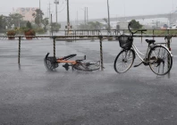 a bicycle falls on the ground in the heavy rain as typhoon bavi approaches in ishigaki japan july 10 2026 reuters