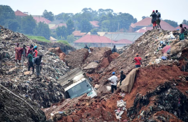 people gather as volunteers search to retrieve the bodies of residents killed by a landslide due to heavy rainfall in a landfill known as kiteezi that serves as garbage dumping site in the lusanja village outside kampala uganda august 10 2024 photo reuters