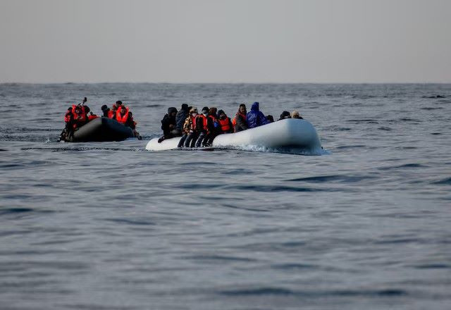 two inflatable dinghies carrying migrants make their way towards england in the english channel britain may 4 2024 reuters