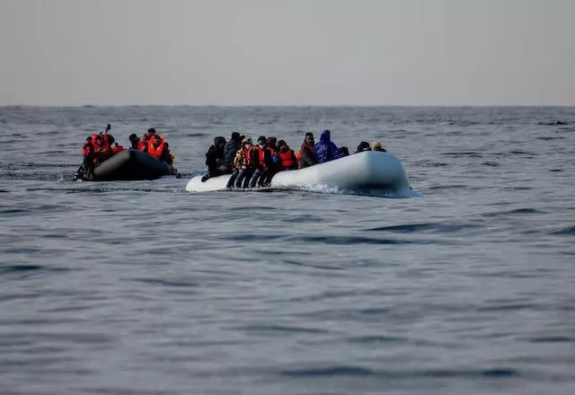 two inflatable dinghies carrying migrants make their way towards england in the english channel britain may 4 2024 reuters two inflatable dinghies carrying migrants make their way towards england in the english channel britain may 4 2024 reuters