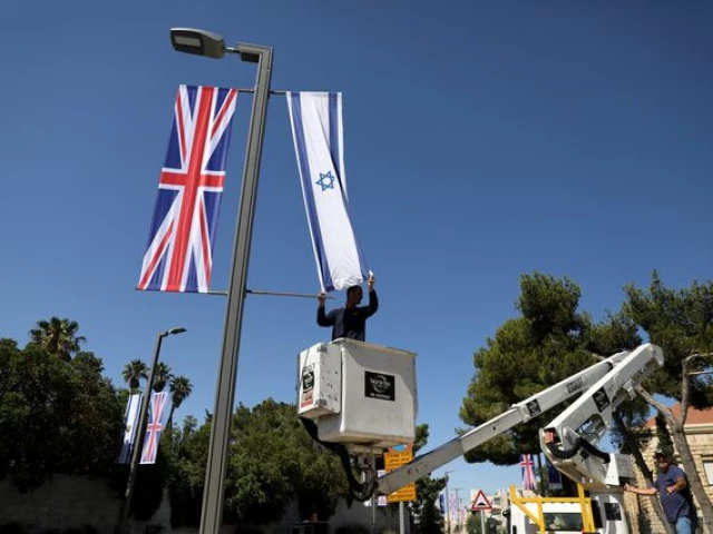 an israeli flag is seen next to the british flag the union jack in this file photo photo reuters