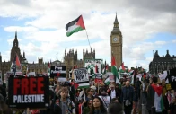 people cross westminster bridge as they take part in a national march in support of palestine organised by palestine solidarity campaign in central london on october 10 2026 photo afp