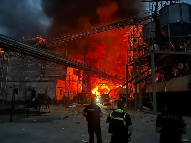 ukrainian law enforcement officers stand next to the burning industrial facility following a russian air attack in the poltava region ukraine in august 2023 file photo afp ukrainian law enforcement officers stand next to the burning industrial facility following a russian air attack in the poltava region ukraine in august 2023 file photo afp