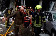 rescuers carry an injured resident at the site of an apartment building which was heavily damaged during russian missile and drone strikes amid russia s attack on ukraine in kyiv ukraine july 6 2026 photo reuters