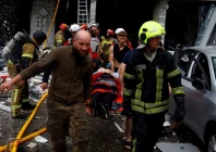 rescuers carry an injured resident at the site of an apartment building which was heavily damaged during russian missile and drone strikes amid russia s attack on ukraine in kyiv ukraine july 6 2026 photo reuters