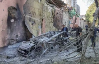 residents look at a burned car at a site of a russian missile strike amid russia s attack on ukraine in kyiv region ukraine august 1 2026 reuters