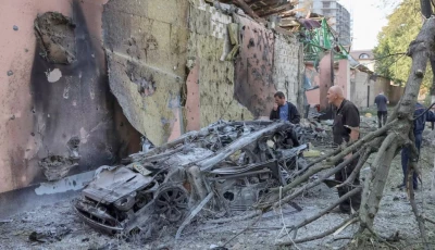 residents look at a burned car at a site of a russian missile strike amid russia s attack on ukraine in kyiv region ukraine august 1 2026 reuters