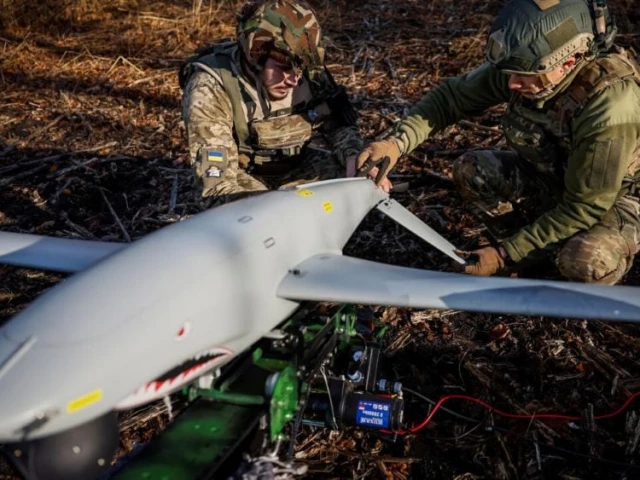 servicemen of the 15th separate artillery reconnaissance brigade of the armed forces of ukraine prepare a shark drone for launching in kharkiv region ukraine october 30 2023 photo reuters servicemen of the 15th separate artillery reconnaissance brigade of the armed forces of ukraine prepare a shark drone for launching in kharkiv region ukraine october 30 2023 photo reuters