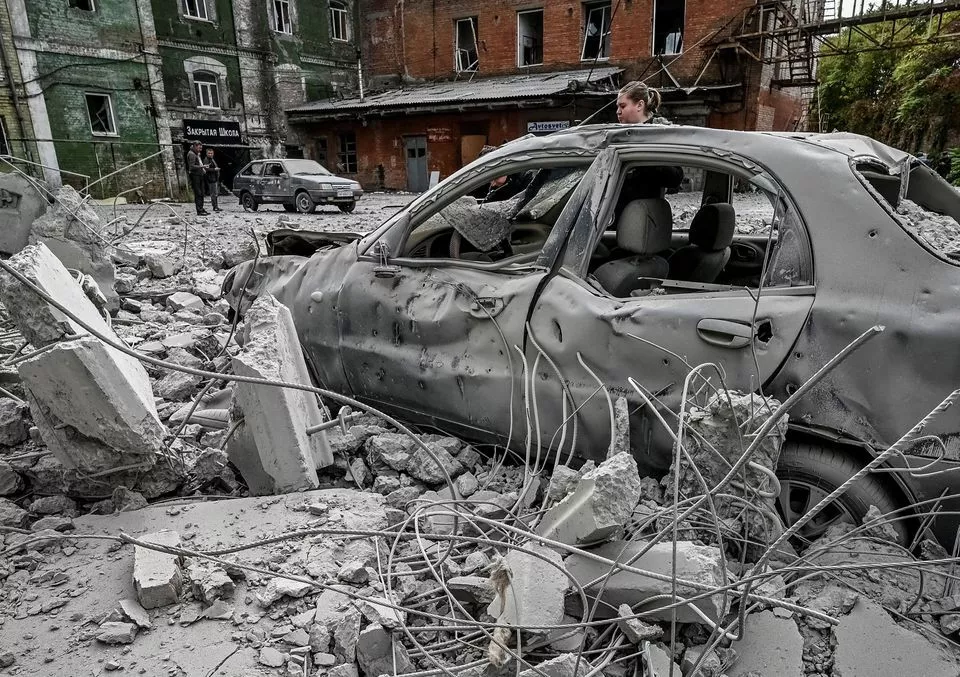 a woman stands near her destroyed car near an old mill built around 1885 also destroyed during a russian missile attack in zaporizhzhia ukraine october 14 2022 photo reuters a woman stands near her destroyed car near an old mill built around 1885 also destroyed during a russian missile attack in zaporizhzhia ukraine october 14 2022 photo reuters