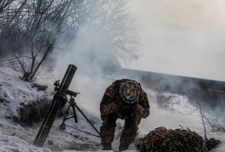 a ukrainian service member fires a mortar towards russian troops in frontline near the vuhledar town amid russia s attack on ukraine in donetsk region ukraine february 7 2023 reuters yevhenii zavhorodnii
