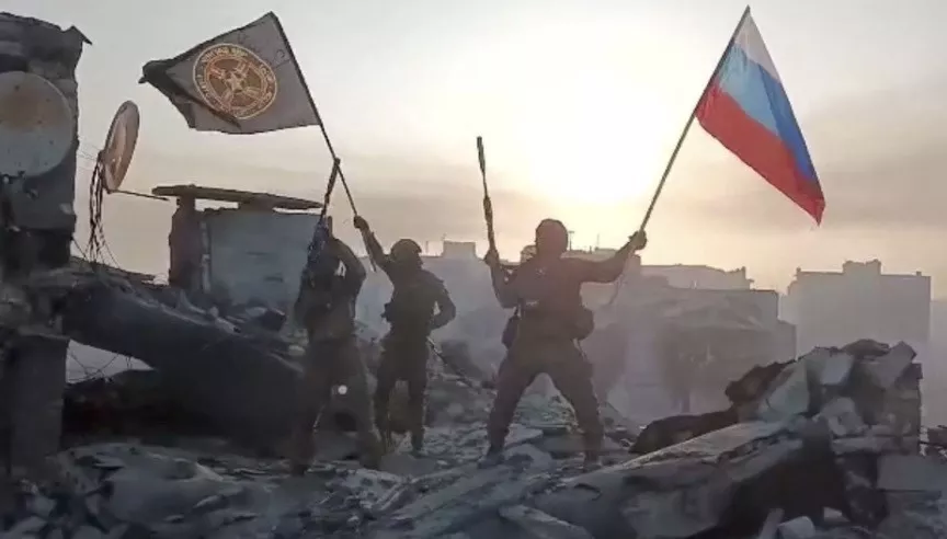 wagner mercenary group fighters wave flags of russia and wagner group on top of a building in an unidentified location in the course of the russia ukraine conflict in this still image obtained from a video released on may 20 2023 along with a statement by russian mercenary chief yevgeny prigozhin about taking full control of the ukrainian city of bakhmut press service of concord handout via reuters wagner mercenary group fighters wave flags of russia and wagner group on top of a building in an unidentified location in the course of the russia ukraine conflict in this still image obtained from a video released on may 20 2023 along with a statement by russian mercenary chief yevgeny prigozhin about taking full control of the ukrainian city of bakhmut press service of concord handout via reuters