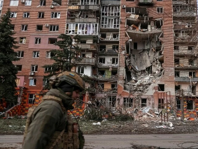 a ukrainian serviceman passes by a residential building damaged by russian military strikes amid russia s attack on ukraine in the frontline town of pokrovsk in donetsk region ukraine march 6 reuters