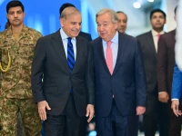 prime minister shehbaz sharif and united nations secretary general antonio guterres walk along a corridor at the prime minister s house before their meeting in islamabad on wednesday photo pmo