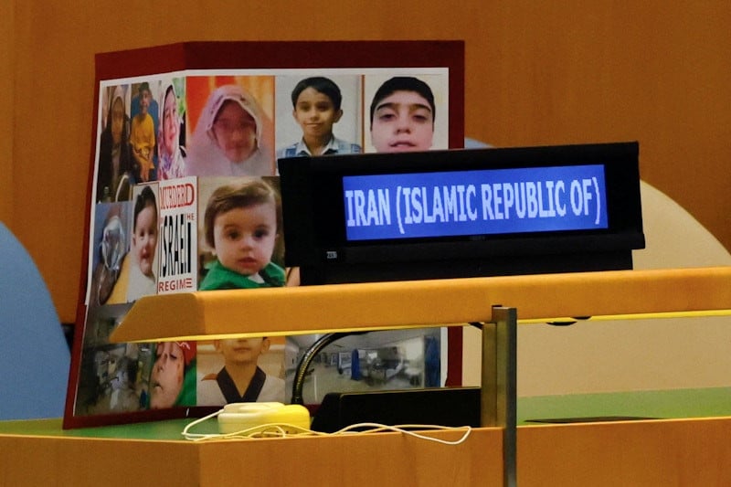 A sign left by the Iranian delegation with images of children they say were killed by Israel.PHOTO:REUTERS