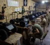 military mechanic with the call sign chimera watches fellow soldiers of nc13 a unit of ukraine s third army corps that specializes in the combat use of unmanned ground vehicles ugv prepare new vehicles for field use in a workshop in the kharkiv region ukraine on may 22 2026 photo reuters