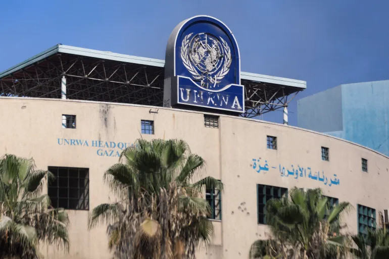 a damaged sign is pictured at the headquarters of unrwa following an israeli raid amid the israel hamas conflict in gaza city photo reuters