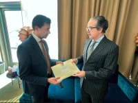 pakistan s permanent representative ambassador asim iftikhar ahmad hands over a letter from deputy prime minister and foreign minister ishaq dar to un security council president ambassador jamal fares alrowaiei of bahrain photo x