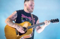 zach bryan sports free palestine shirt during performance