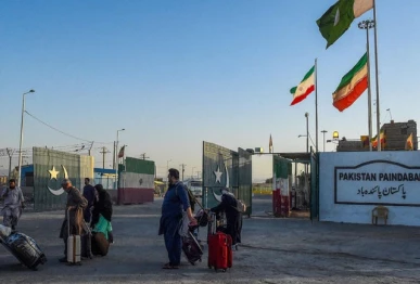 pakistani pilgrims evacuated from iran walk across the pakistan iran border at taftan in balochistan province on june 18 2025 photo afp