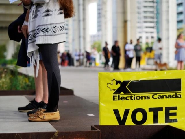 people line up outside a polling station to vote in canada s federal election in toronto ontario canada september 20 2021 photo reuters people line up outside a polling station to vote in canada s federal election in toronto ontario canada september 20 2021 photo reuters