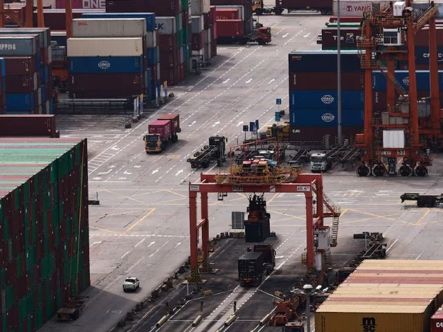 a truck carrying containers moves at the yantian port in shenzhen guangdong province china april 17 2025 photo reuters a truck carrying containers moves at the yantian port in shenzhen guangdong province china april 17 2025 photo reuters