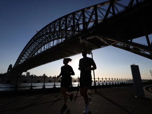 people run under the sydney harbour bridge photo reuters people run under the sydney harbour bridge photo reuters