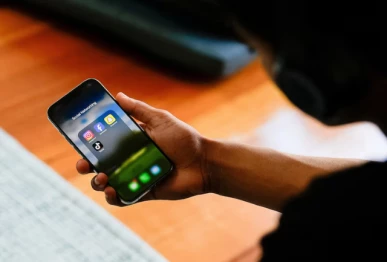 a high school student poses with his mobile phone showing his social media applications in melbourne australia photos reuters