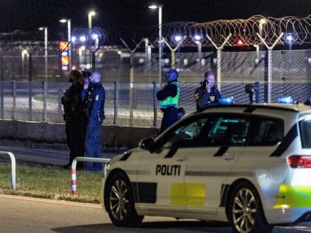 police officers stand guard after all traffic has been closed at the copenhagen airport due to drone reports in copenhagen denmark september 22 2025 reuters